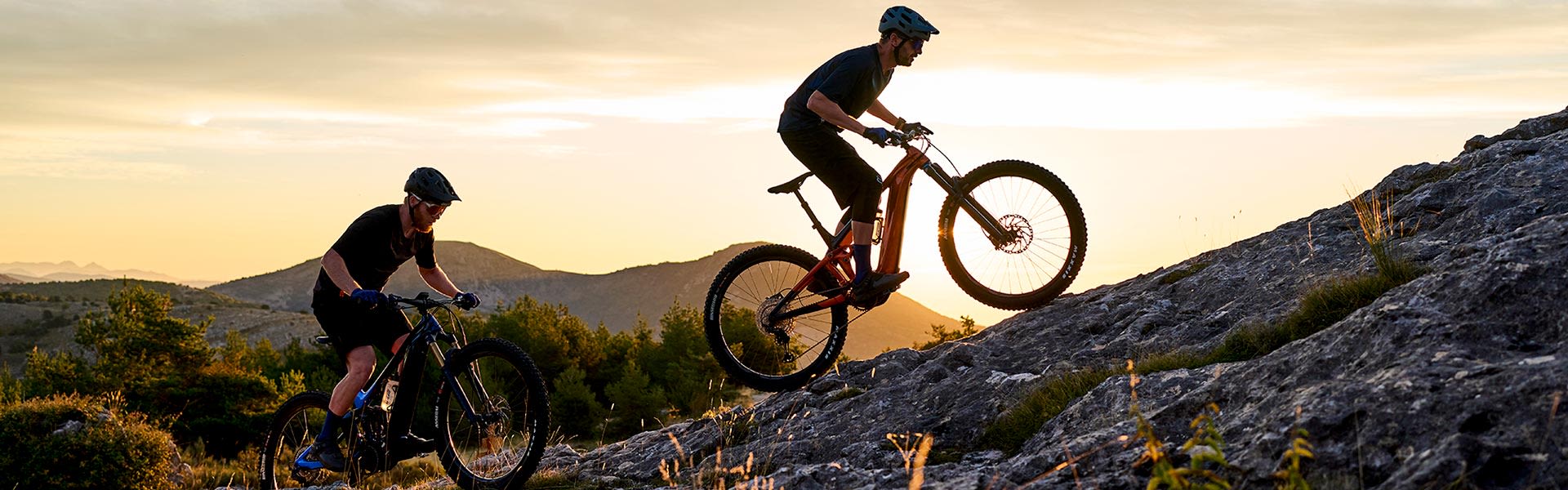 Electric mountain bikers riding in French alps