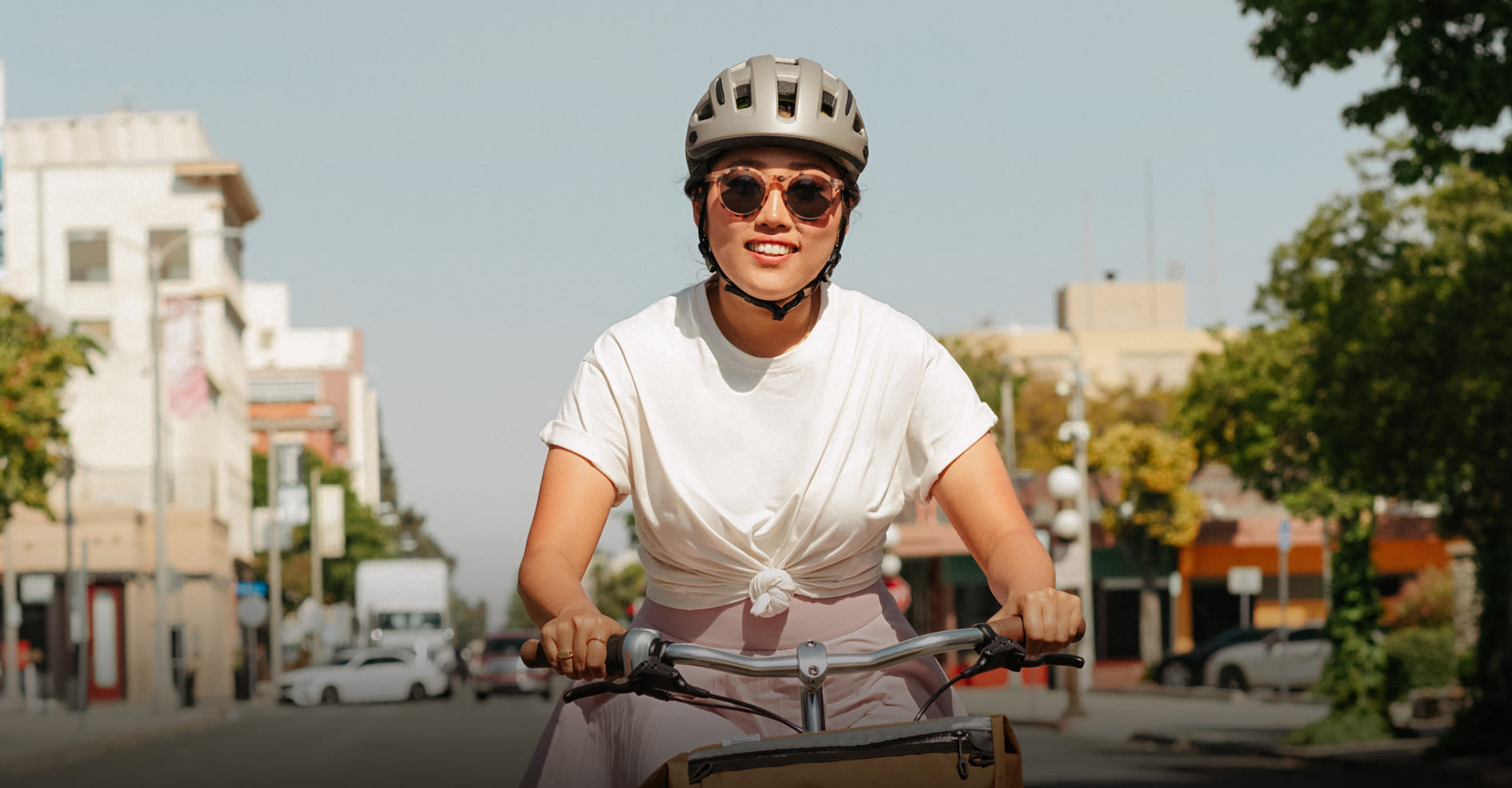 Woman riding a bike wearing a helmet