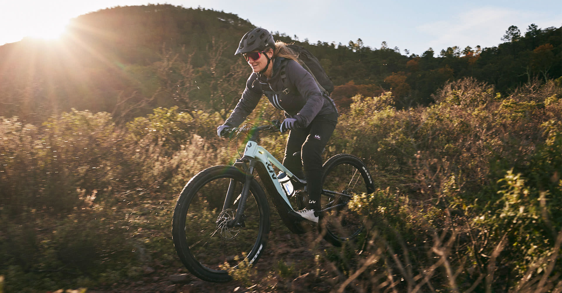 a woman with her son on bikes at an overlook