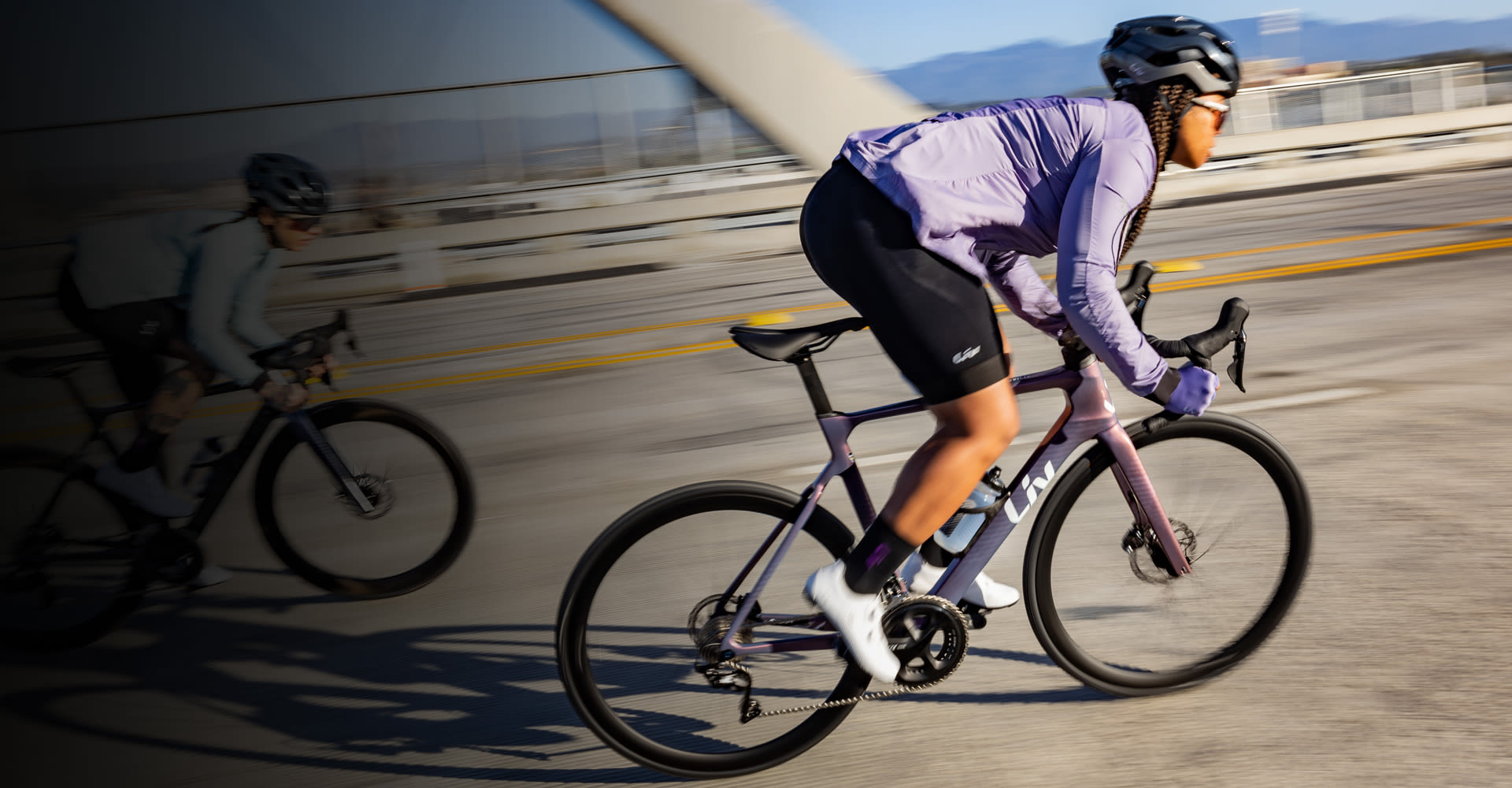 two women riding road bikes
