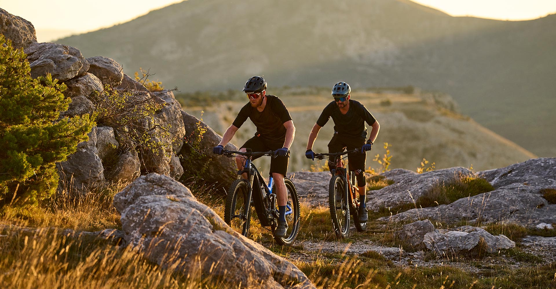 mountain bikers riding electric bikes