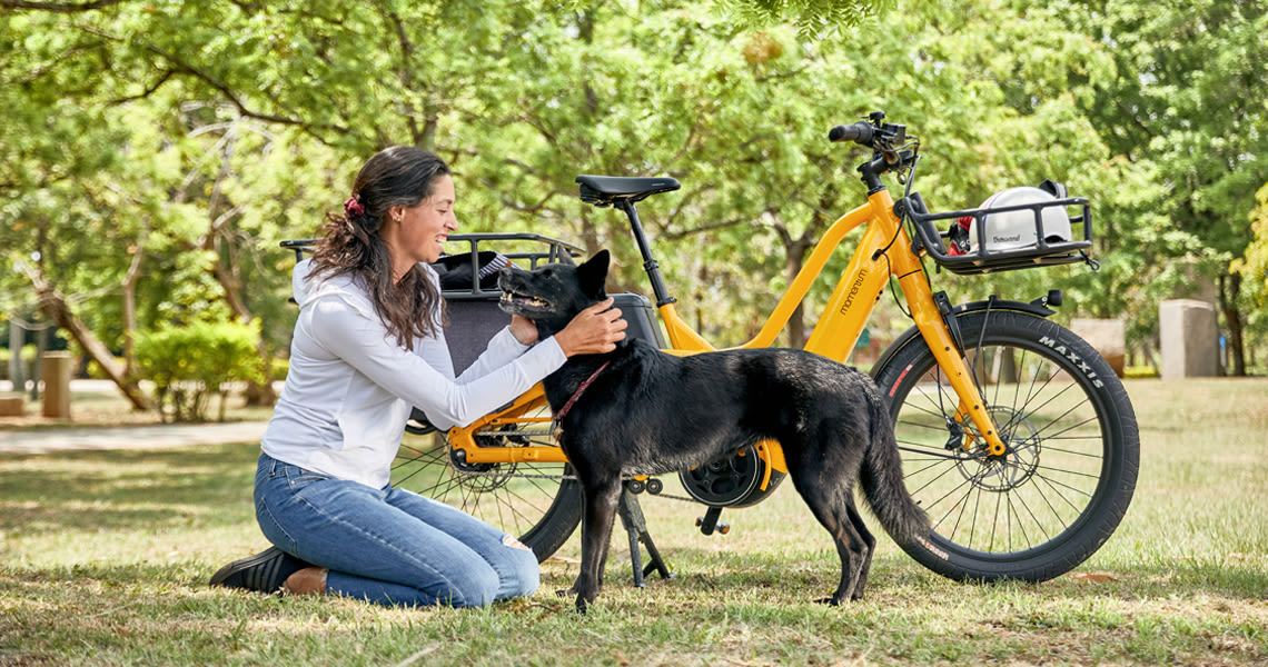 Woman, dog, and bike, electric bikes