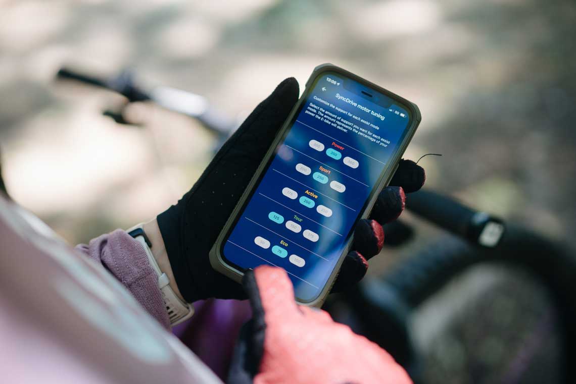 a closeup of a rider using the RideControl App for E-bikes